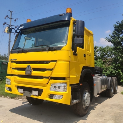 Hw76 キャビンのHOWO あなたの予算内で6800*2500*3200mmのために3軸6X4のトラクターヘッドを使用